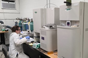 a scientist using instruments in a lab