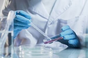 a technicial preparing a chemical analysis test